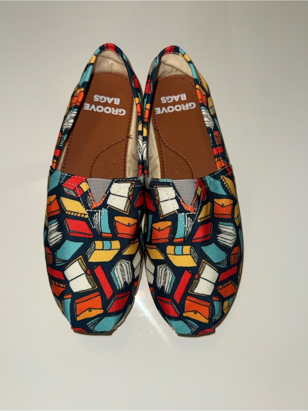 groove Kids Moccasins in Teal, Red, Yellow & White Book Print